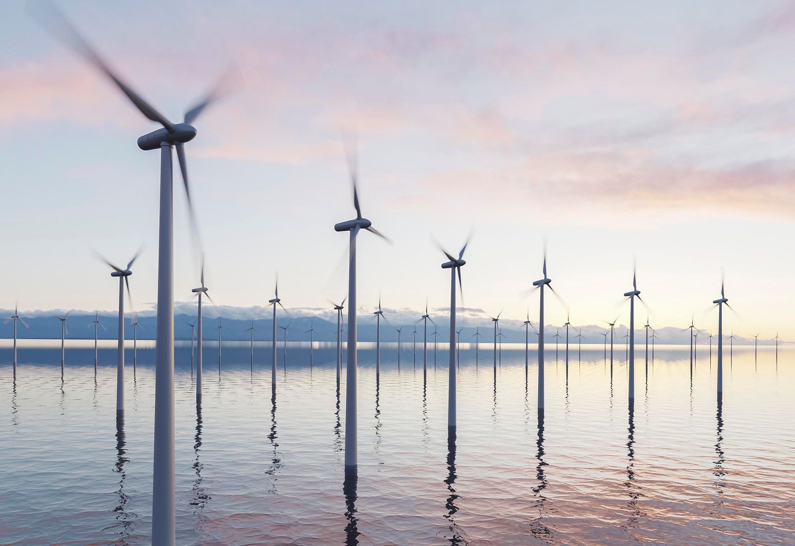 Offshore wind turbines at sunset