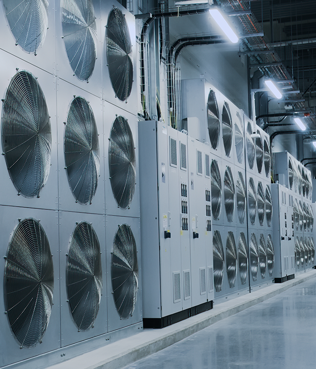 Rows of cooling fan units in a data center hallway